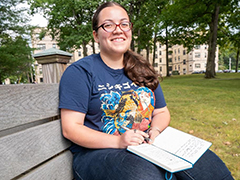 SEU student reading outside on campus